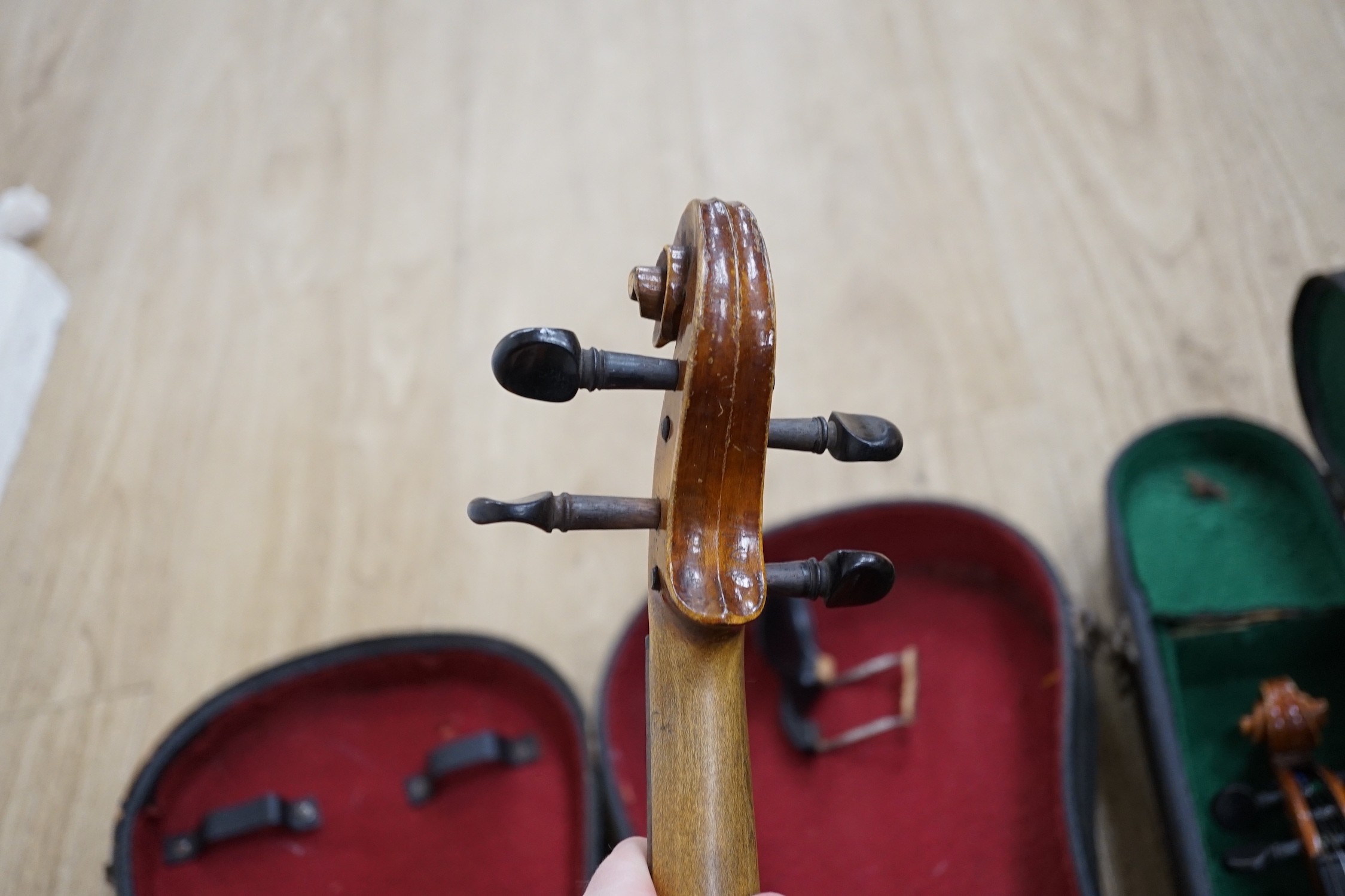 Two cased double back violins